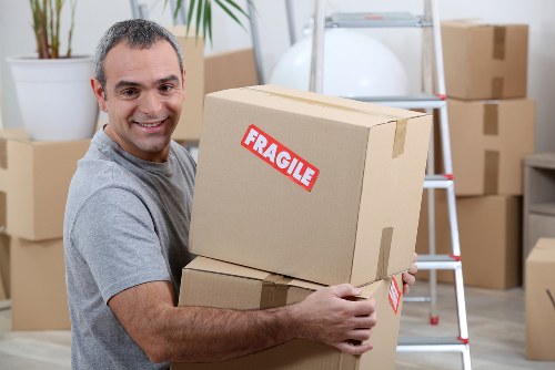 Moving home in Southgate with boxes and furniture ready for loading