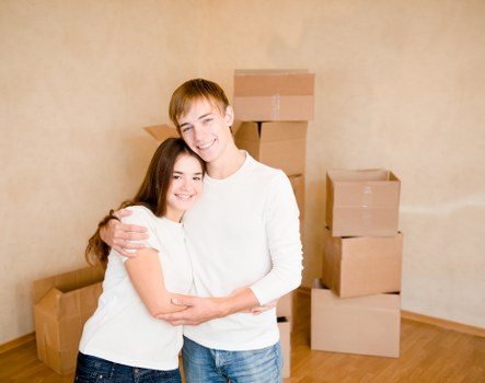 Professional movers handling furniture in a Southgate residential street