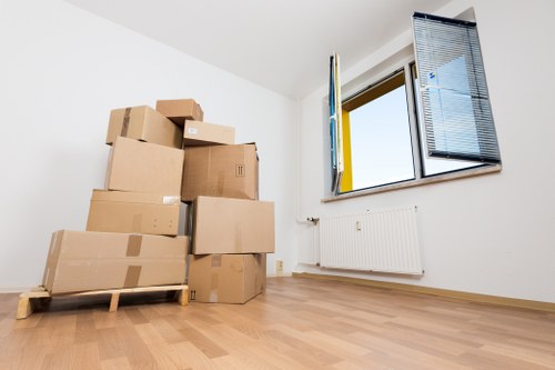 Staff using safe lifting techniques during a property move